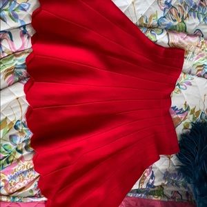 Red sweater like material skirt with scalloped end